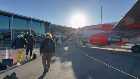 POV-handheld-shot-of-passenger-landed-on-airport-from-easyjet-flight,-sunny-day