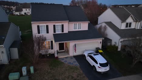 House-in-USA-neighborhood-with-American-flag