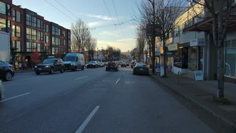 Traffic-On-City-Street-At-Sunset-In-East-Vancouver-Neighbourhood-In-Fall-Season-In-British-Columbia,-Canada