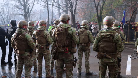 Policemen-And-Soldiers-Standing-In-The-Road-During-The-Great-Union-Day-In-Miercurea-Ciuc,-Romania