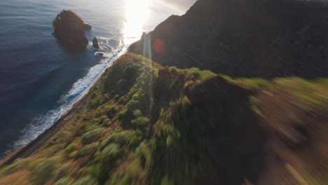 FPV-drone-dive-from-a-mountain-top-to-the-ocean-at-the-coast-of-Madeira