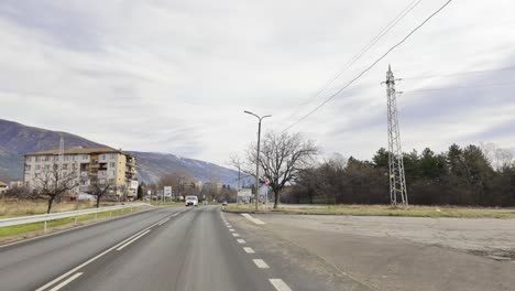 Passing-the-sign-marking-the-start-of-town