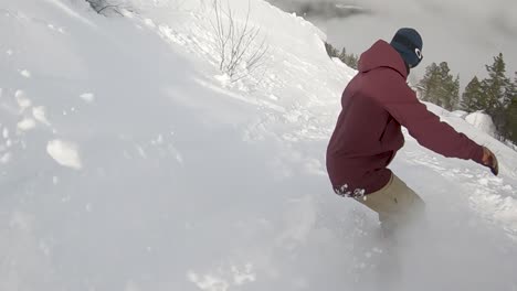 Snowboarder-rides-powder-on-mountain---Slow-motion