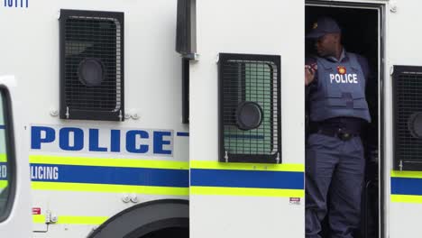 Policeman-stands-in-door-of-Nyala--armored-vehicle