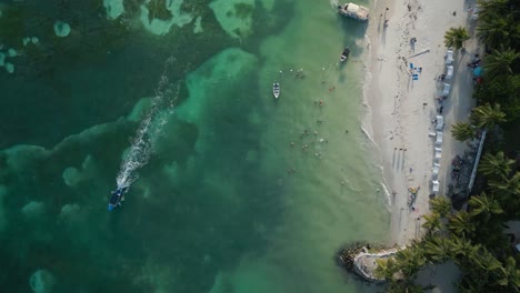 Aerial-View-of-Boat-At-The-Coastline-Of-Caribbean-Sea