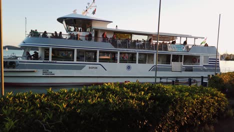 Scheduled-boat-departure-from-Balatonfüred-marina-and-sunset-voyage-on-Lake-Balaton,-Hungary