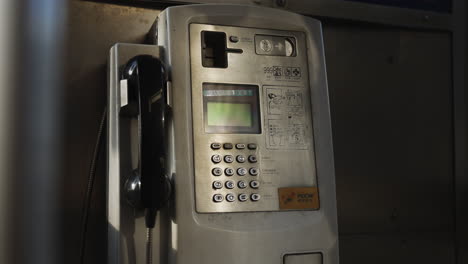 Coin-payphone-on-the-side-of-the-road-in-Hong-Kong,-China