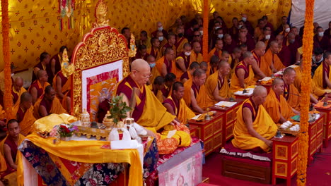 Buddhist-religion-crowd-in-a-Monastery-of-Nepal,-birthplace-of-Buddha,-Lama-gurus,-lama-prayers,-drone-shot-of-spirituality-in-a-whole-peace-of-tradition-4K