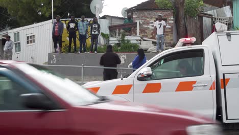 Female-Forensic-Pathologist-sits-in-forensics-vehicle-at-informal-settlement-crime-scene