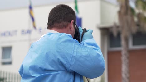 Forensic-detective-photographs-murder-crime-scene-in-Cape-Town