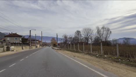 Passing-the-sign-marking-the-start-of-the-village