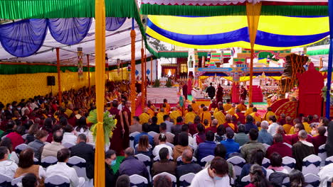 Gathering-in-Buddhist-monastery-of-Nepal,-Holy-ceremony-prayers-by-religious-people,-drone-shot,-peace-4K