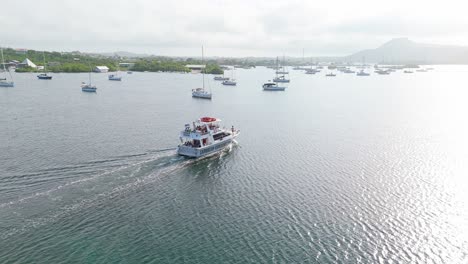 Rear-view-tracking-orbit-around-large-yacht-boat-in-Spanish-Waters-Curacao-at-sunrise