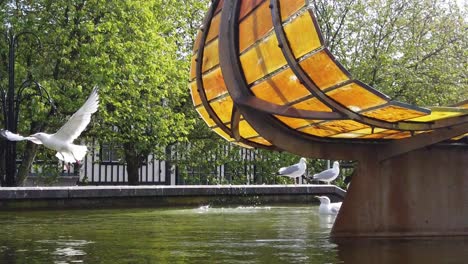 Slow-motion-of-a-Seagull-taking-flight-from-the-Leaf-Boat-statue-in-Swansea