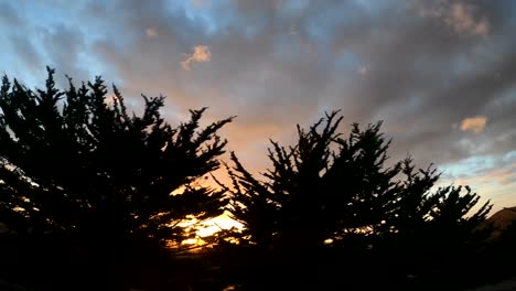 Colorful-Sunset-Sky-Driving-Along-The-Pacific-Coast-Highway-In-Monterey-Bay,-California