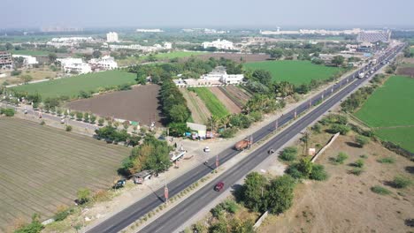 Aerial-drone-view-camera-moving-forward-where-plots-and-fields-are-visible