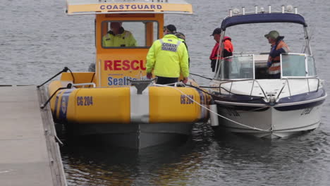 Australian-Coast-Guard-maneuvers-into-a-jetty,-rescuing-a-stranded-fishing-boat