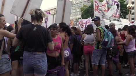 Feminist-female-protesters-hold-signs-to-march-protest-and-claim-their-rights-during-Women's-day-celebrations