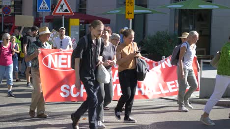 Fridays-for-Future-FFF-protest-by-young-and-elderly-activists-on-the-way-to-march-against-climate-change-and-for-green-energy-and-sustainability-in-Stuttgart,-Germany