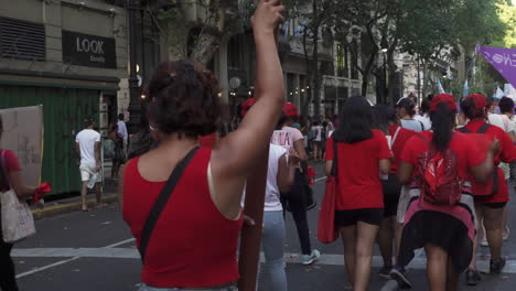 feminist-activist-dressed-in-red-manifest-at-rally-for-their-rights