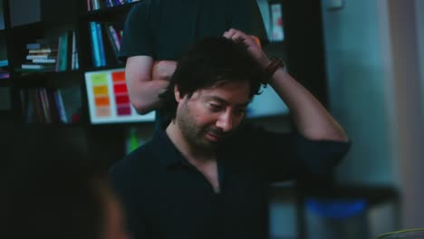 Beautiful-latino-man-scratches-his-hair-during-meeting-in-office-lens-whack