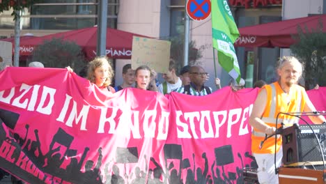 Fridays-for-Future-FFF-protest-with-youth-and-elderly-marching-together-on-the-street-against-climate-change-and-for-green-energy-and-sustainability-in-Stuttgart,-Germany