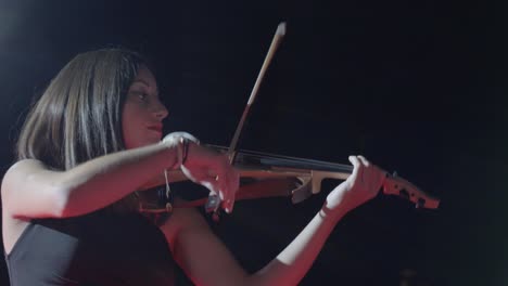 Close-up-shot-of-a-violinist-performing-enthusiastically-at-a-corporate-event