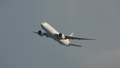 White-Air-Canada-Twin-Engine-Passenger-Plane-Rising-Through-The-Air-After-Take-Off