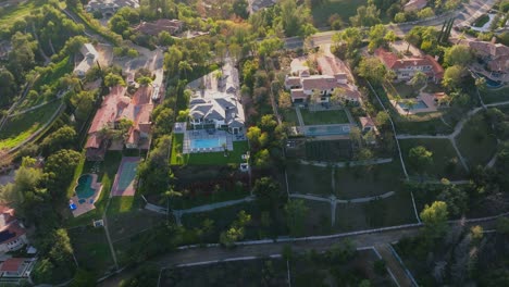 Dream-Homes-Nestled-in-the-Hills-Seen-from-Sky-at-Sunset,-Calabasas-Neighborhood-of-Hidden-Hills