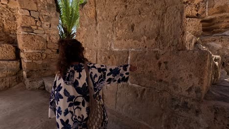 Person-exploring-ancient-ruins-in-Carthage,-Tunisia