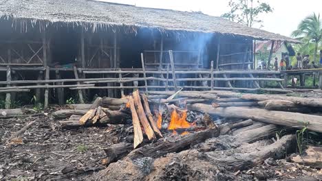 Fire-Pit-outside-simple-Bachelor's-Bujang-wooden-hut-house-in-Papua-Indonesia