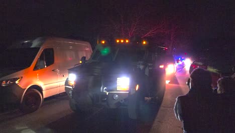 Armoured-Police-Truck-Slowly-Driving-At-Night-In-Lewiston,-Maine