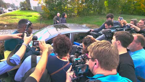 News-Crews-Crowding-Round-Car-Trying-To-Get-Interview-With-Witness-Regarding-Mass-shooting-In-Lewiston,-Maine