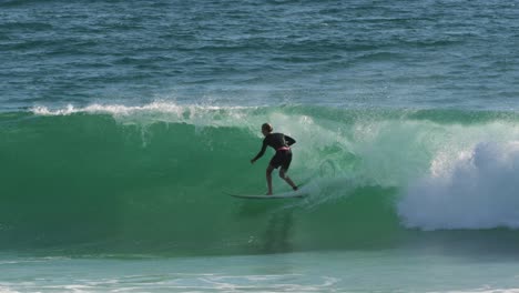 Surfer-enjoying-the-waves-on-a-sunny-day,-Burleigh-Heads,-Gold-Coast,-Australia