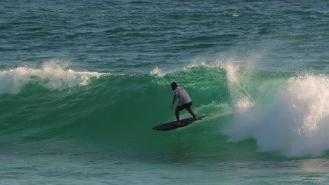 Surfers-enjoying-the-waves-on-a-sunny-day,-Burleigh-Heads,-Gold-Coast,-Australia