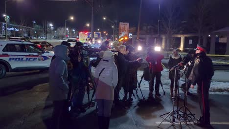 Canadian-police-giving-an-interview-outside-to-reporters-in-winter-season