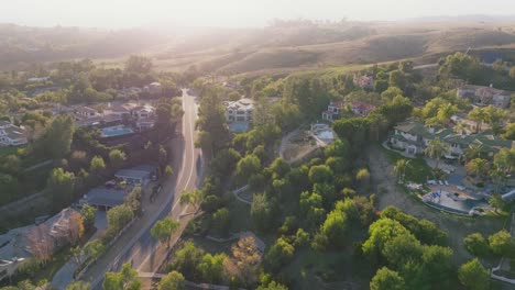 Drone-Flying-Over-Exclusive-Neighborhood-of-Hidden-Hills,-Calabasas-at-Sunlit-Golden-Hour