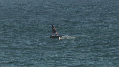 Surfers-enjoying-the-waves-on-a-sunny-day,-Burleigh-Heads,-Gold-Coast,-Australia