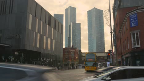 View-of-Manchester-city-center-with-busy-traffic-and-skyscrapers-in-the-background