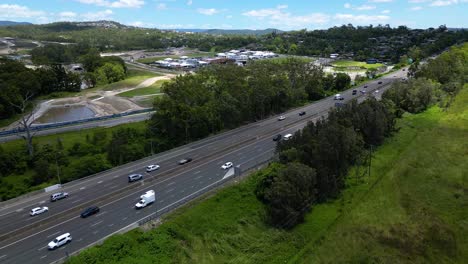 Rising-Aerial-view-of-the-SkyRidge-residential-development-on-a-sunny-day-adjacent-to-the-M1,-Worongary,-Gold-Coast