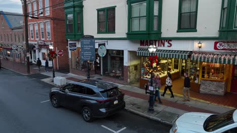 Pedestrian-walking-on-sidewalk-in-small-town-of-america