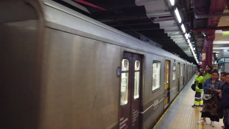 A-Line-A-Underground-Train-Arrives-to-Metro-Station-with-Local-Young-Latin-Woman-Walking-By