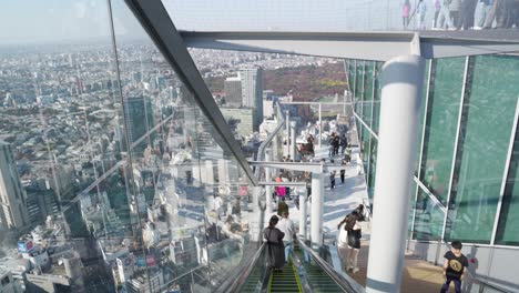 Visitors-on-observation-deck-of-Tokyo-Skytree-overlooking-cityscape-in-Tokyo,-Japan,-daytime