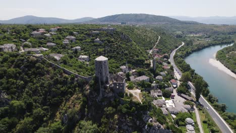 Historic-Počitelj-Citadel-Over-Neretva-River,-Bosnia---aerial