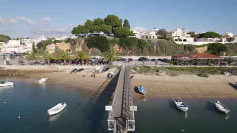 Alvor's-Idyllic-Marina-with-Pier-and-Moored-Boats,-Algarve-Portugal---aerial