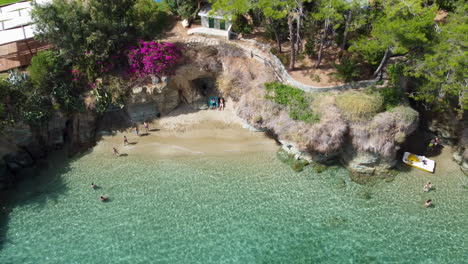 Swimmers-enjoy-an-inlet-at-the-Agia-Pelagia-beach-in-Crete