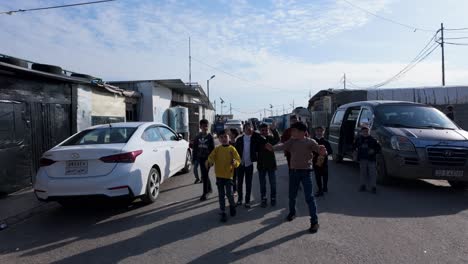 Children-talk-to-visitors-at-the-Harsham-Refugee-Camp-near-Erbil,-Iraq-for-internally-displaced-people-IDP