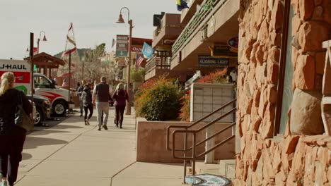 Downton-Sedona,-Arizona-with-shoppers-walking-on-sidewalk-with-stable-medium-shot