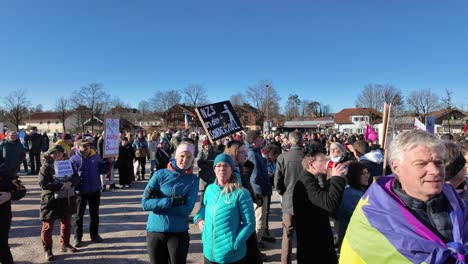 Young-people-protesting-against-far-right,-holding-up-signs