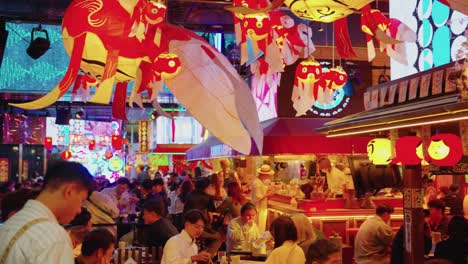 Slow-motion-pan-across-busy-entertainment-center-in-central-Shinjuku-Tokyo